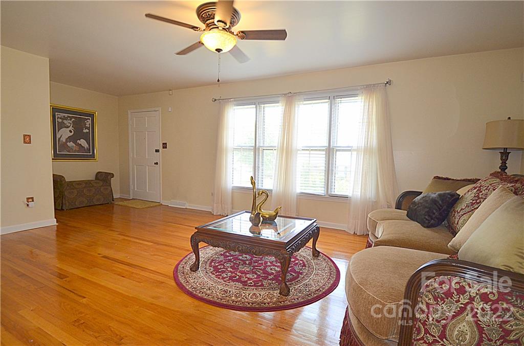 7433 Riding Trail Road Charlotte, NC 28212 - Photo 7 of 42 a living room with furniture and a window