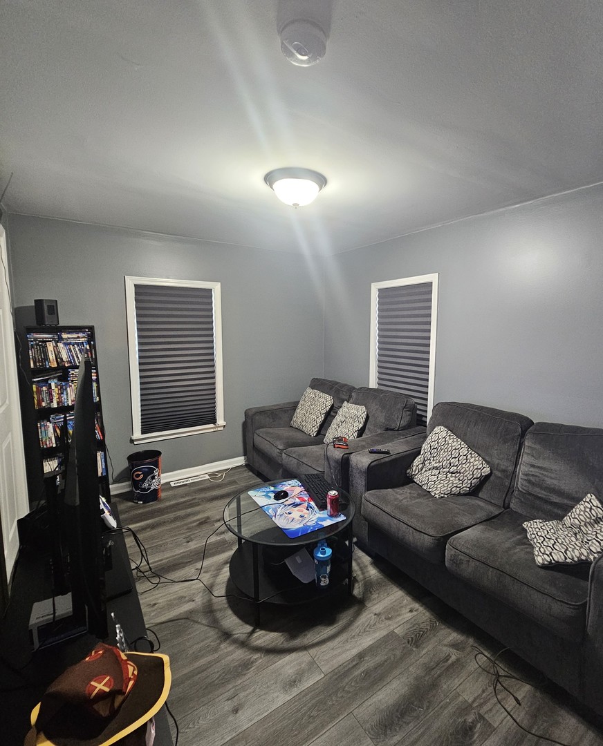 900 Charles Street Aurora, IL 60506 - Photo 8 of 14 a living room with furniture and a window
