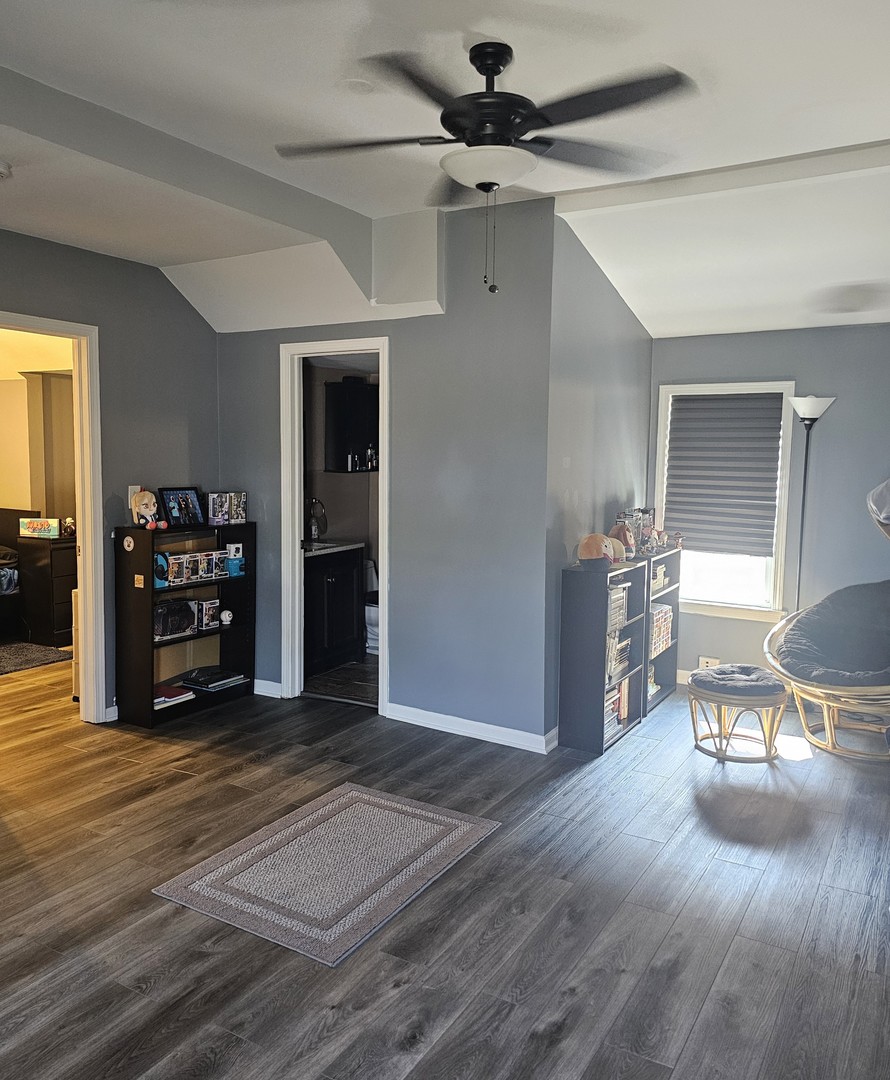 900 Charles Street Aurora, IL 60506 - Photo 9 of 14 a view of a livingroom with furniture and a ceiling fan