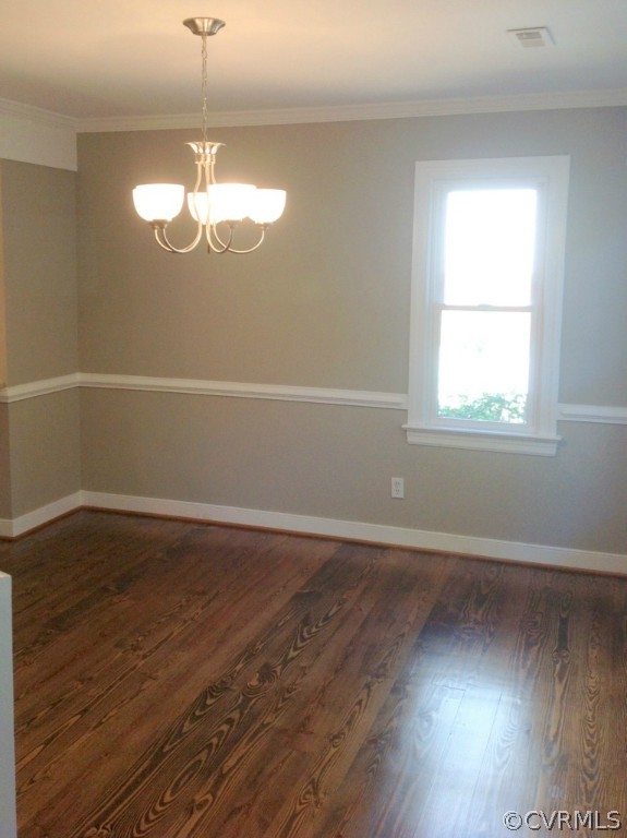 9713 Kendrick Road Richmond, VA 23236 - Photo 8 of 11 an empty room with wooden floor and window