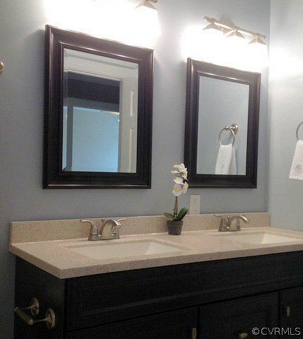 9713 Kendrick Road Richmond, VA 23236 - Photo 10 of 11 a bathroom with mirror a sink and vanity