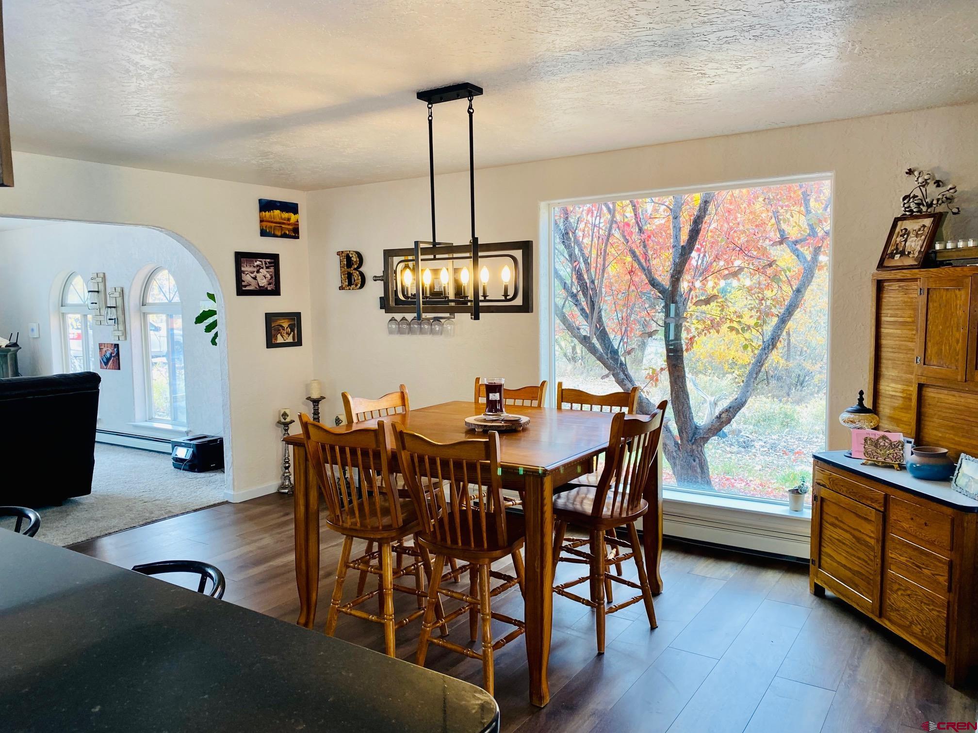 1755 F50 Road Delta, CO 81416 - Photo 8 of 30 a view of a dining room with furniture window and wooden floor