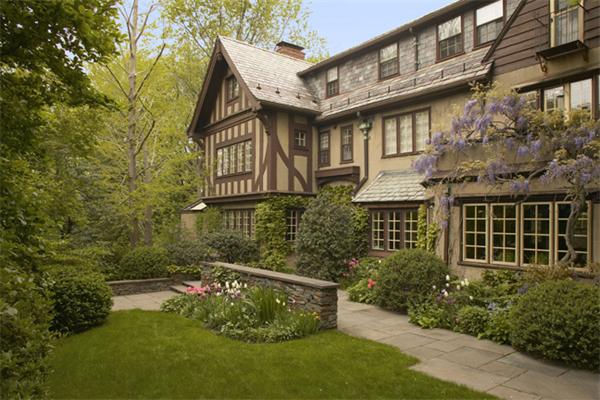 8 Lincoln Lane Cambridge, MA 02138 - Photo 1 of 13 a view of a house with brick walls and a yard with plants