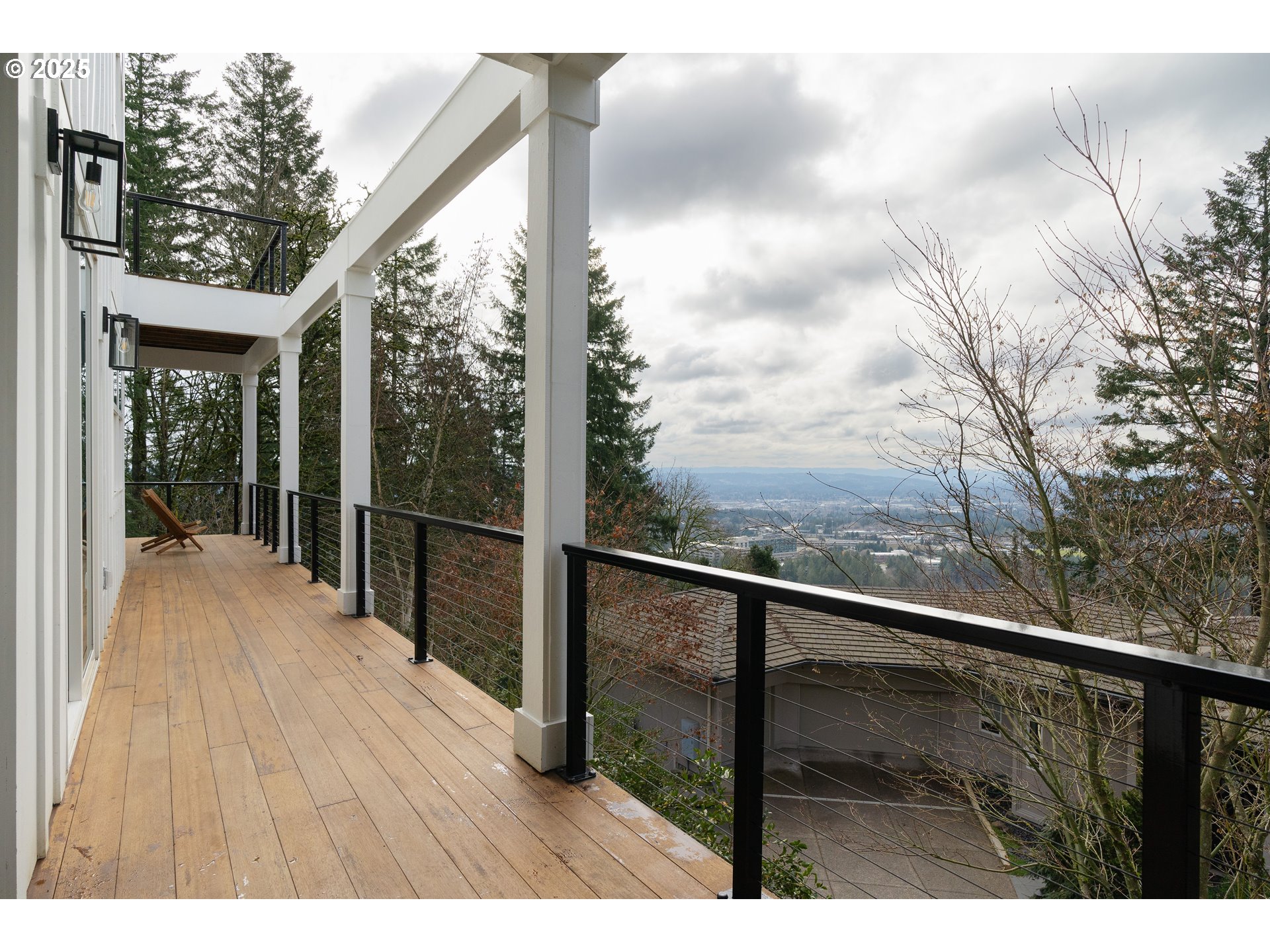 290 Southwest Moonridge Place Portland, OR 97225 - Photo 14 of 46 a view of balcony with wooden floor and fence