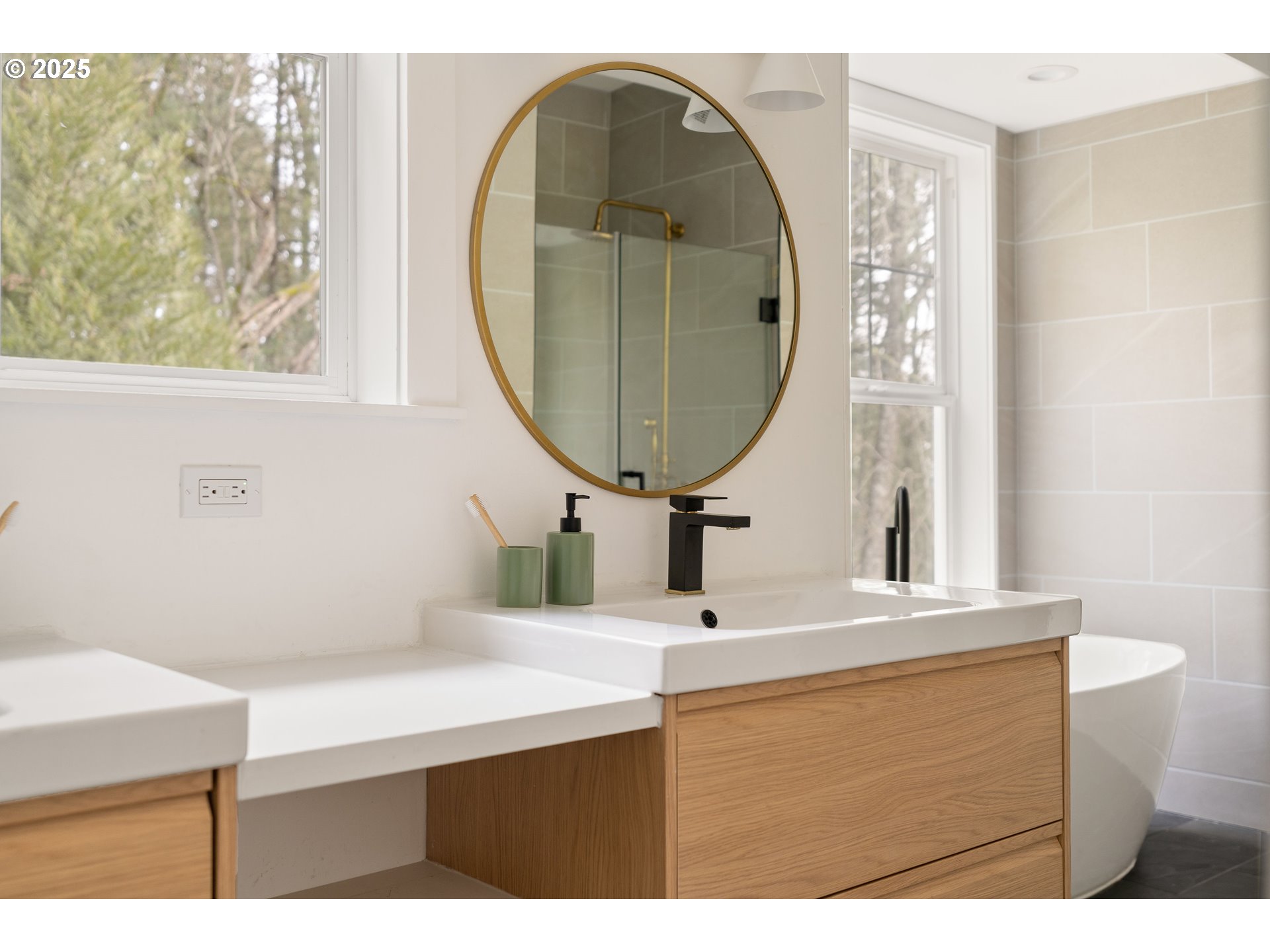 290 Southwest Moonridge Place Portland, OR 97225 - Photo 19 of 46 a bathroom with a sink a mirror and a vanity