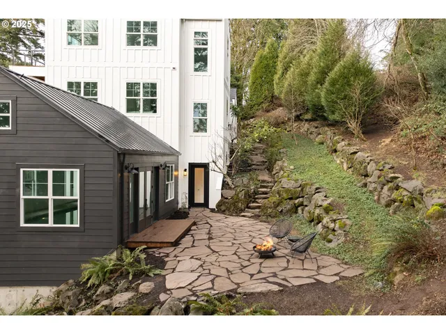 a view of a porch with plants and wooden fence
