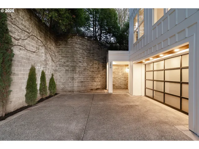 a view of an empty room with a fireplace and a large window
