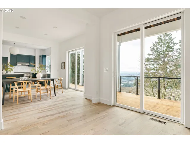 a room with lots of furniture and a large window