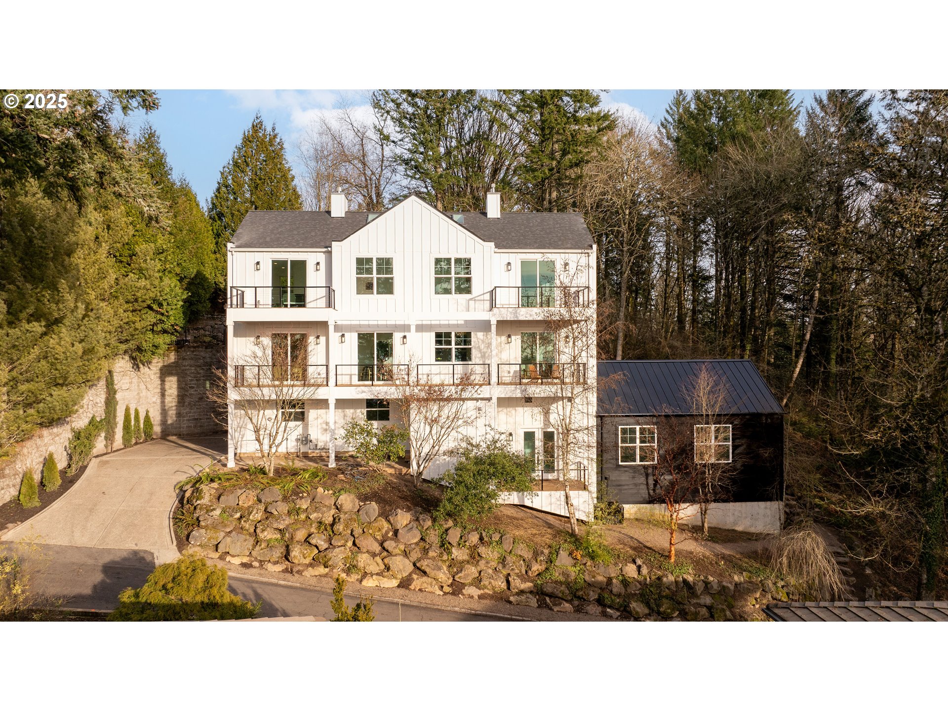 290 Southwest Moonridge Place Portland, OR 97225 - Photo 41 of 46 a view of a white house with a yard