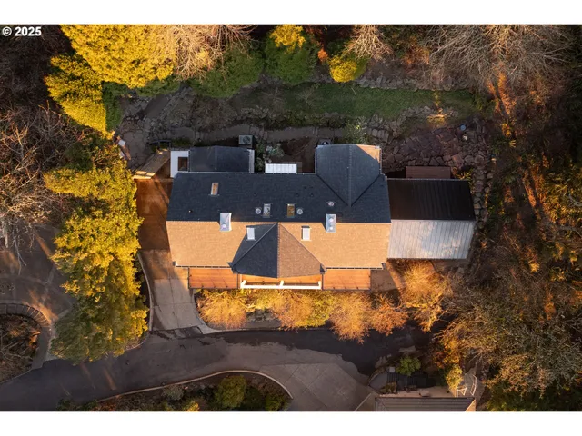 a view of house with backyard