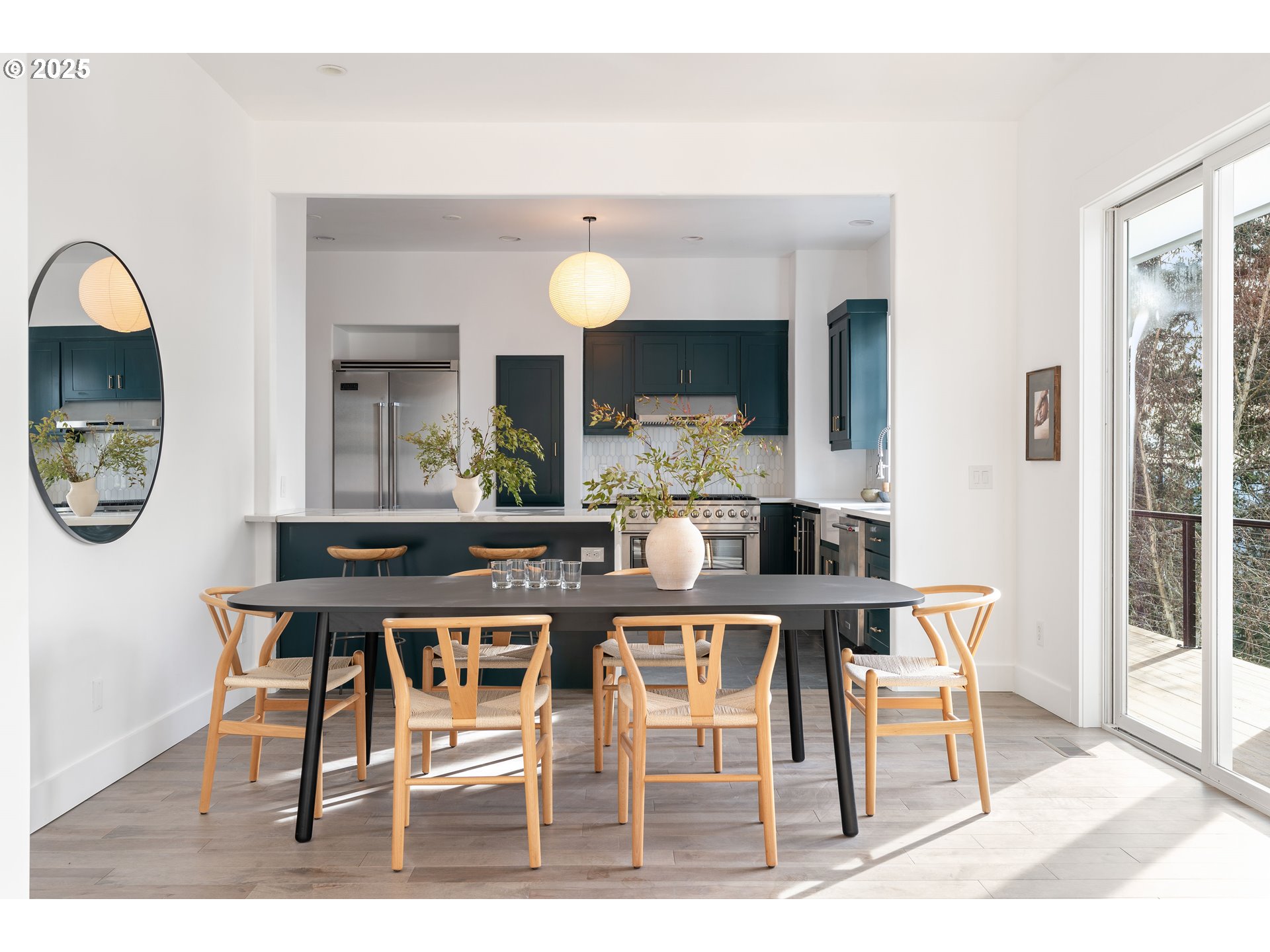 290 Southwest Moonridge Place Portland, OR 97225 - Photo 6 of 46 a view of a dining room with furniture and a large window