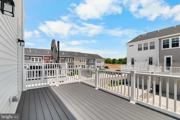 a view of a balcony with wooden floor
