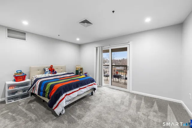 a bathroom with a sink a toilet and shower curtain