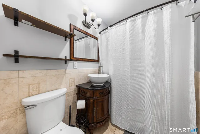 a bedroom with a bed and furniture