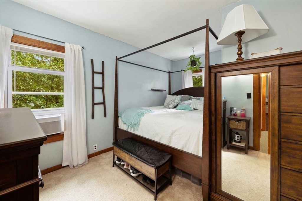 89-91 East Street Mansfield, MA 02048 - Photo 11 of 38 a bedroom with a bed and a window