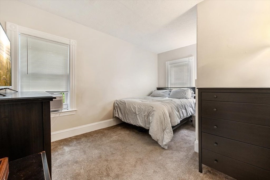 89-91 East Street Mansfield, MA 02048 - Photo 21 of 38 a bedroom with a bed and a window