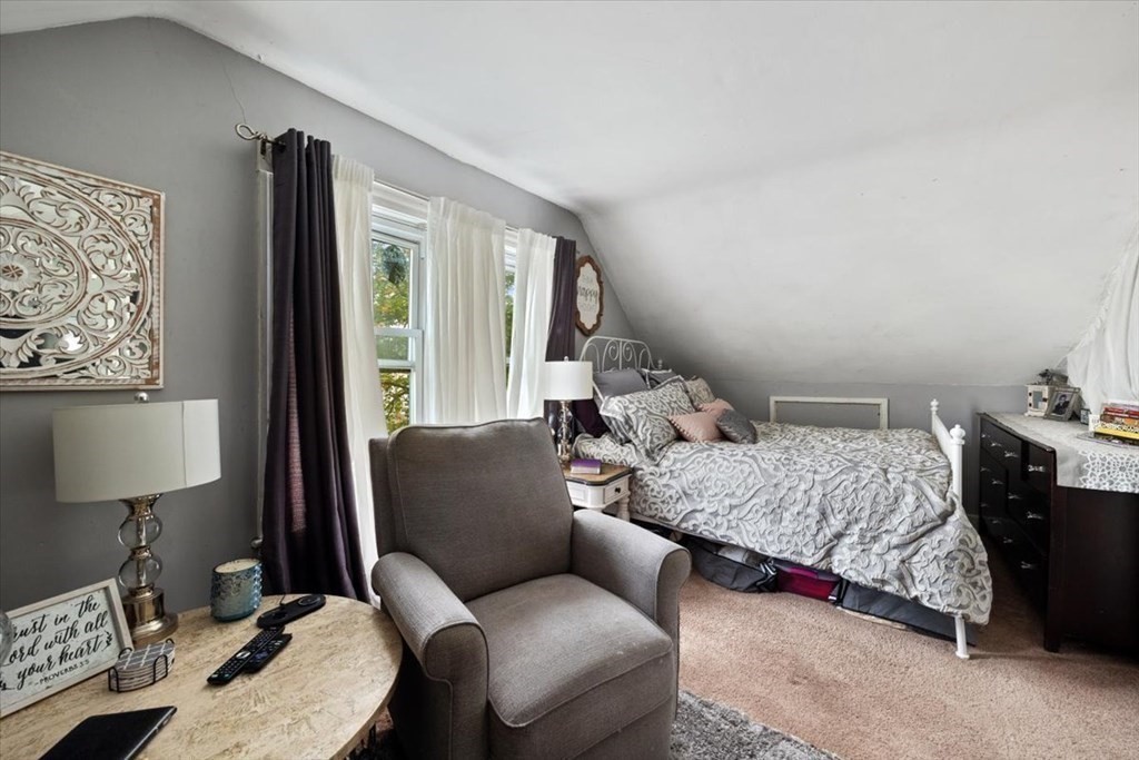 89-91 East Street Mansfield, MA 02048 - Photo 26 of 38 a bedroom with furniture and a lamp