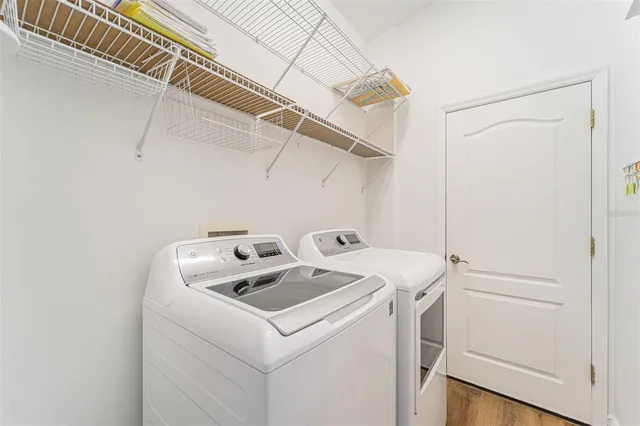 a utility room with dryer and washer
