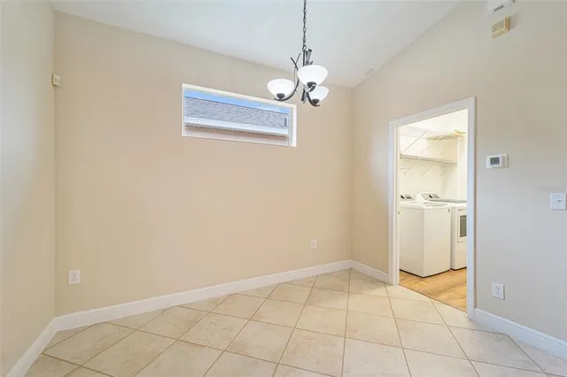 a view of an empty room with a bathroom
