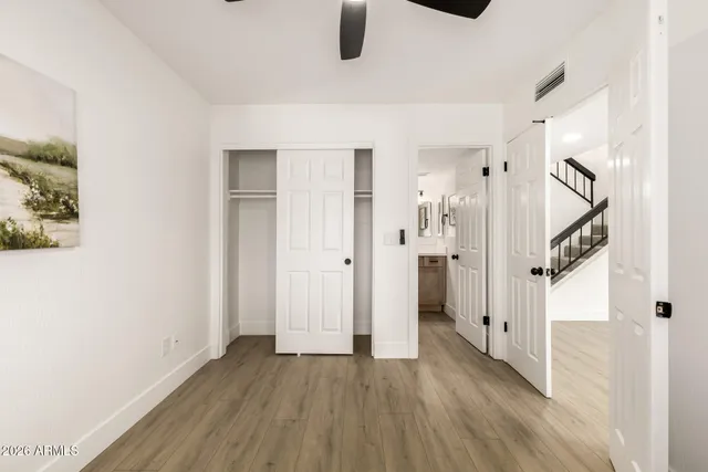 a bathroom with a sink mirror toilet and shower