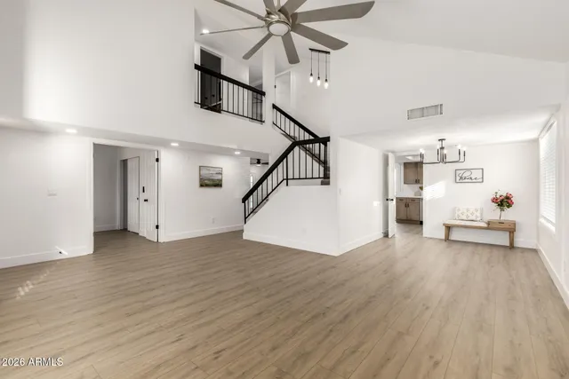 a view of a livingroom with furniture and hardwood floor