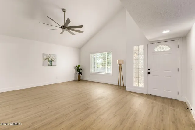 wooden floor in an empty room with a window