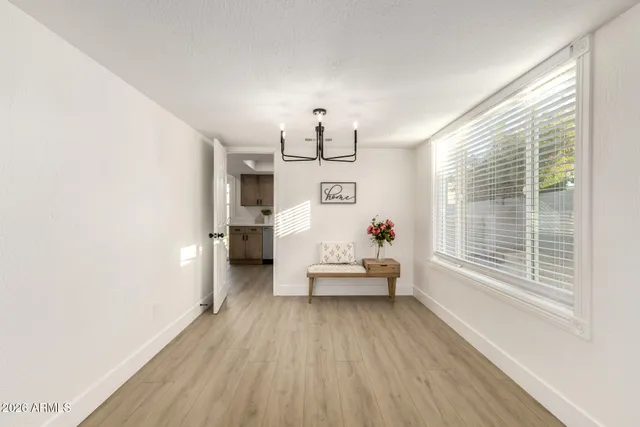 a view of a livingroom with furniture wooden floor and a window