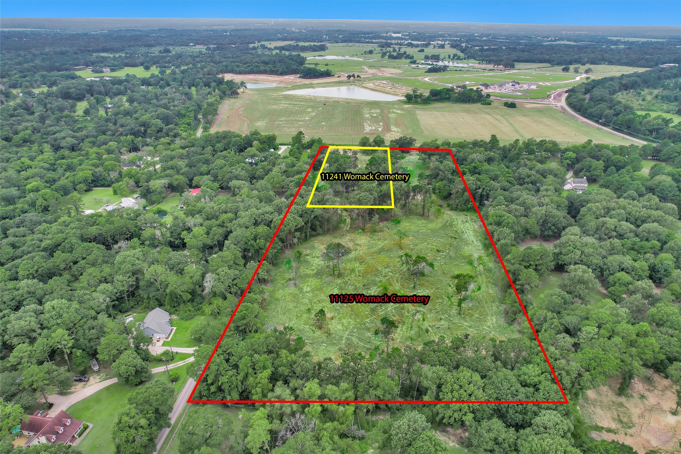 10.548-acres Womack Cemetery Road Montgomery, TX 77316 - Photo 8 of 15 an aerial view of green landscape with trees houses and mountain view