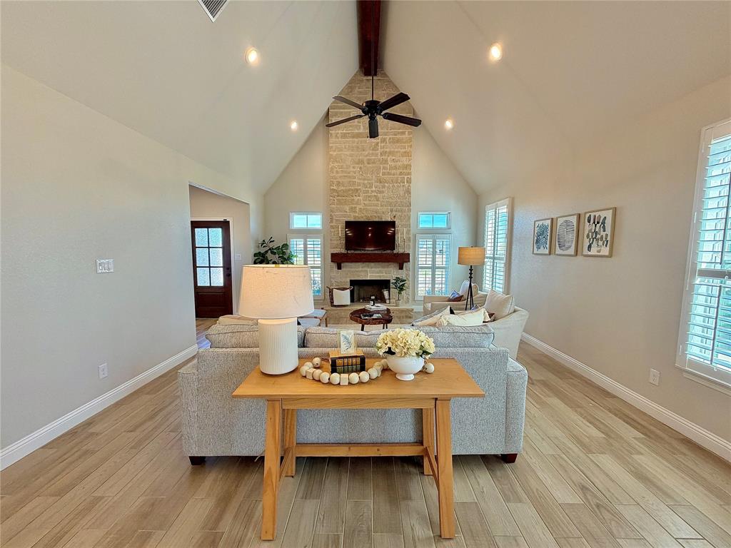 649 Gray Road Burleson, TX 76028 - Photo 15 of 28 a living room with furniture a fireplace and a flat screen tv