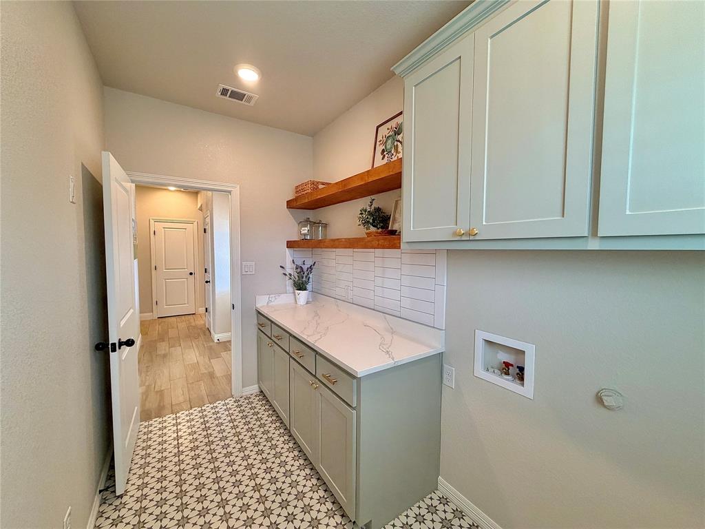 649 Gray Road Burleson, TX 76028 - Photo 18 of 28 a kitchen with a sink and cabinets