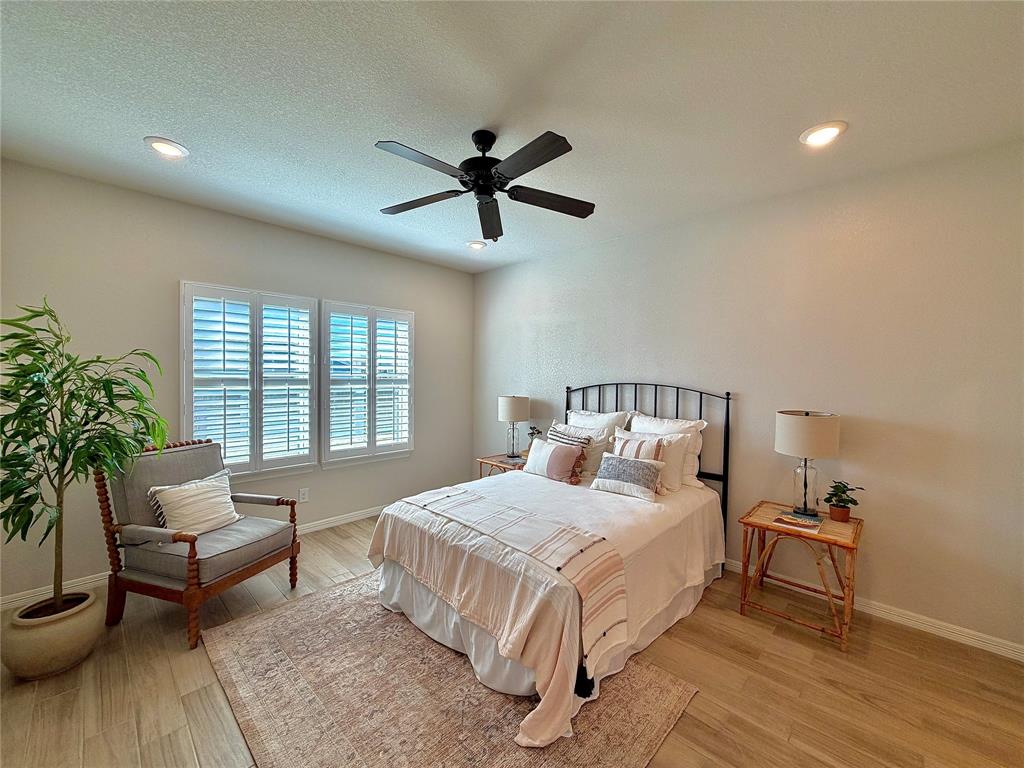 649 Gray Road Burleson, TX 76028 - Photo 20 of 28 a bedroom with a bed and a couch