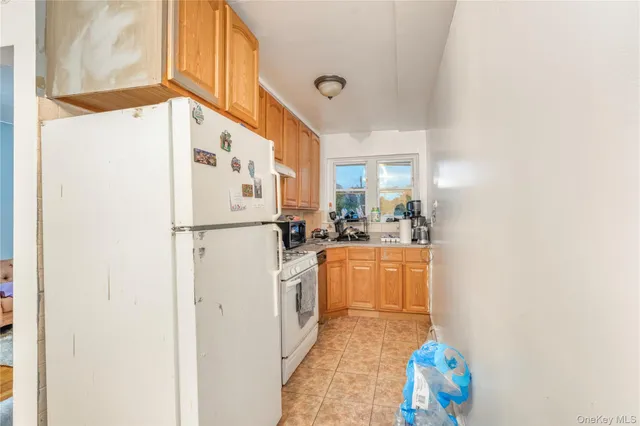 a kitchen with refrigerator and stove