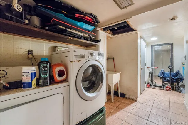 a utility room with dryer and washer