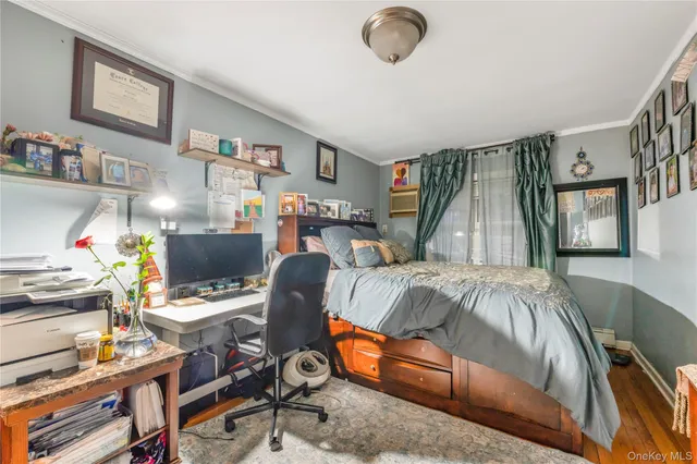 a bedroom with a bed and a desk
