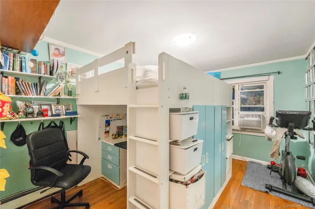 a living room with furniture and a book shelf