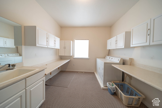 190 600 North Ferron, UT 84523 - Photo 19 of 85 Extra large laundry room with sink, two extra long folding tables and plenty of storage.
