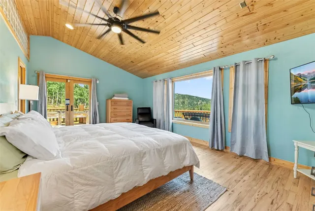 a bedroom with a bed dresser and a window