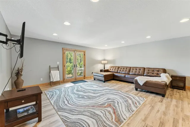 a spacious bedroom with a bed and a couch