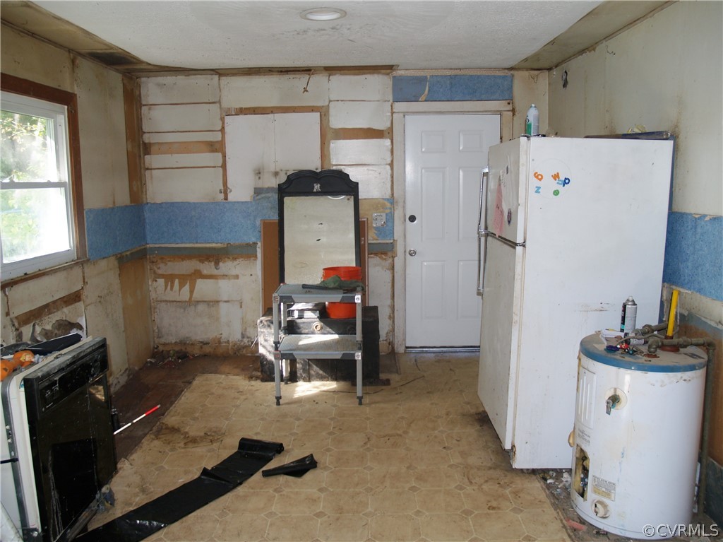 9570 Richmond Road Lanexa, VA 23089 - Photo 5 of 11 Electric H2O heater; kitchen cabinets removed.