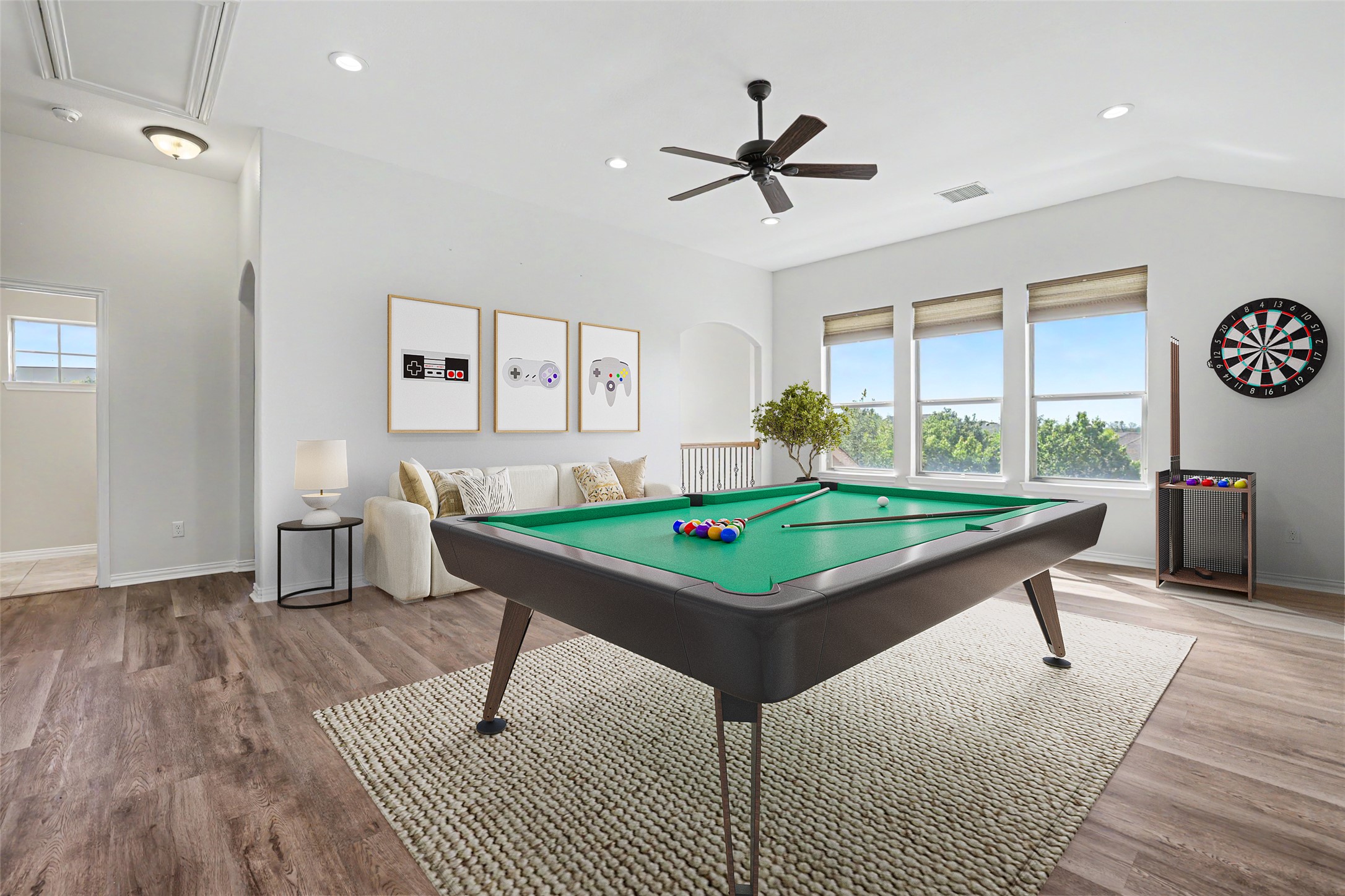 1020 Winding Way Drive Georgetown, TX 78628 - Photo 18 of 32 This spacious recreational area features hardwood flooring, a ceiling fan, and large windows providing ample natural light