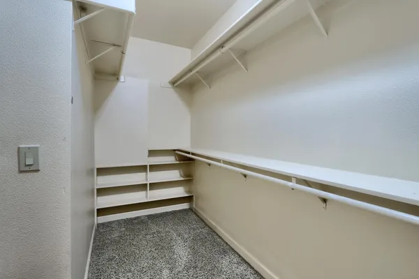 an empty room that has a mirror in it