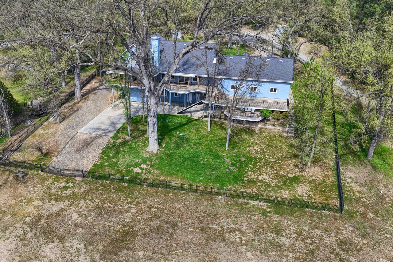 46580 Vista Del Rio Drive Oakhurst, CA 93644 - Photo 74 of 82 a aerial view of a house with a yard