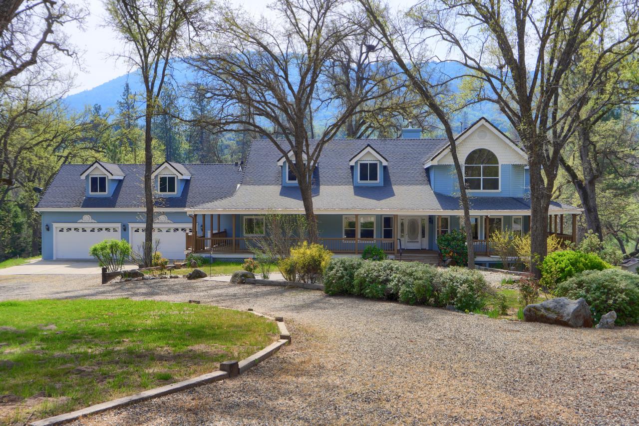 46580 Vista Del Rio Drive Oakhurst, CA 93644 - Photo 78 of 82 a front view of a house with garden