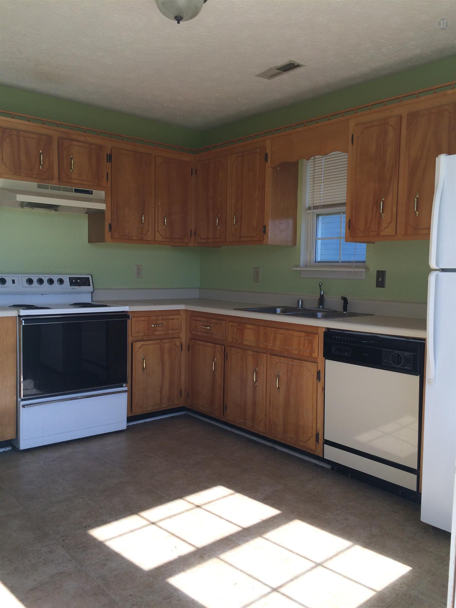 955 State Line Road Oak Grove, KY 42262 - Photo 1 of 14 a kitchen with stainless steel appliances kitchen island granite countertop a sink and cabinets