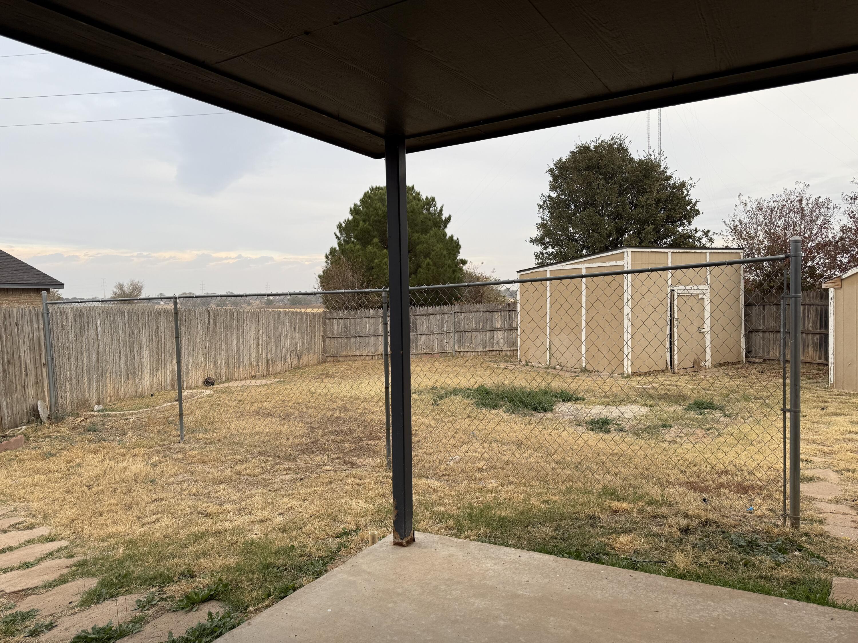 10602 Akron Avenue Lubbock, TX 79423 - Photo 16 of 16 a view of a backyard of the house