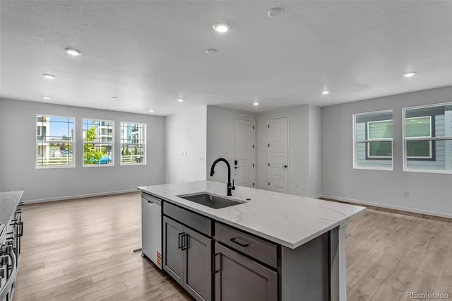 a kitchen with a sink and window