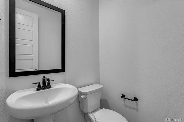 a bathroom with a sink and a toilet