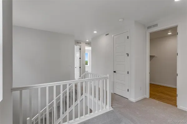 a view of hallway with chandelier