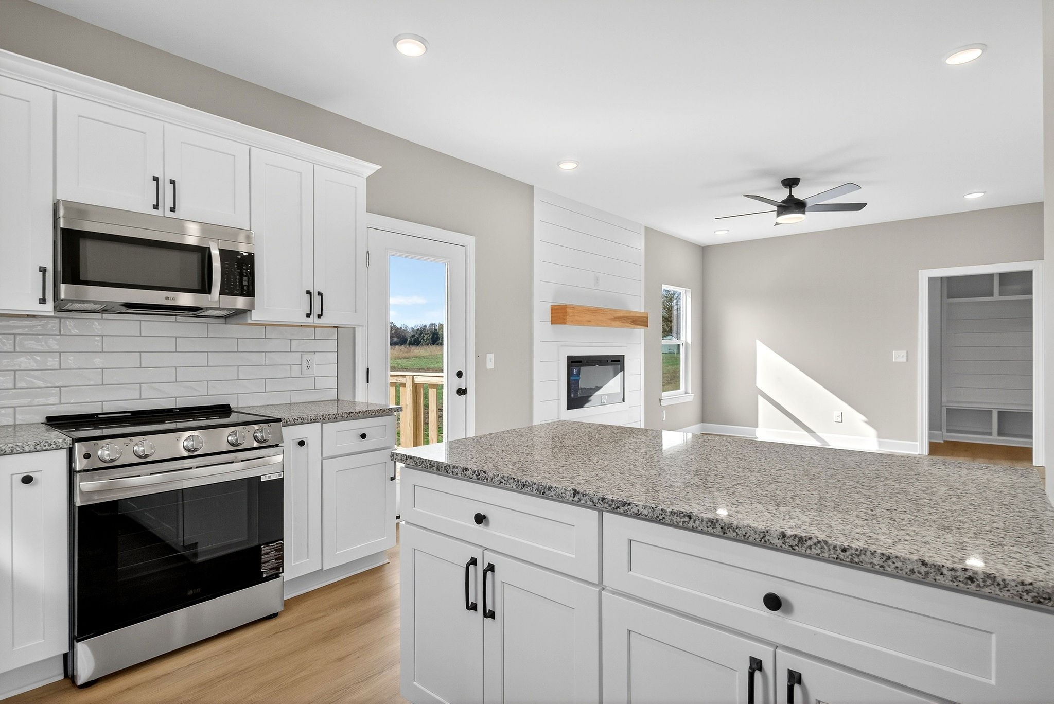 774 C Rody Road McMinnville, TN 37110 - Photo 11 of 40 a kitchen with granite countertop a stove and a sink cabinets
