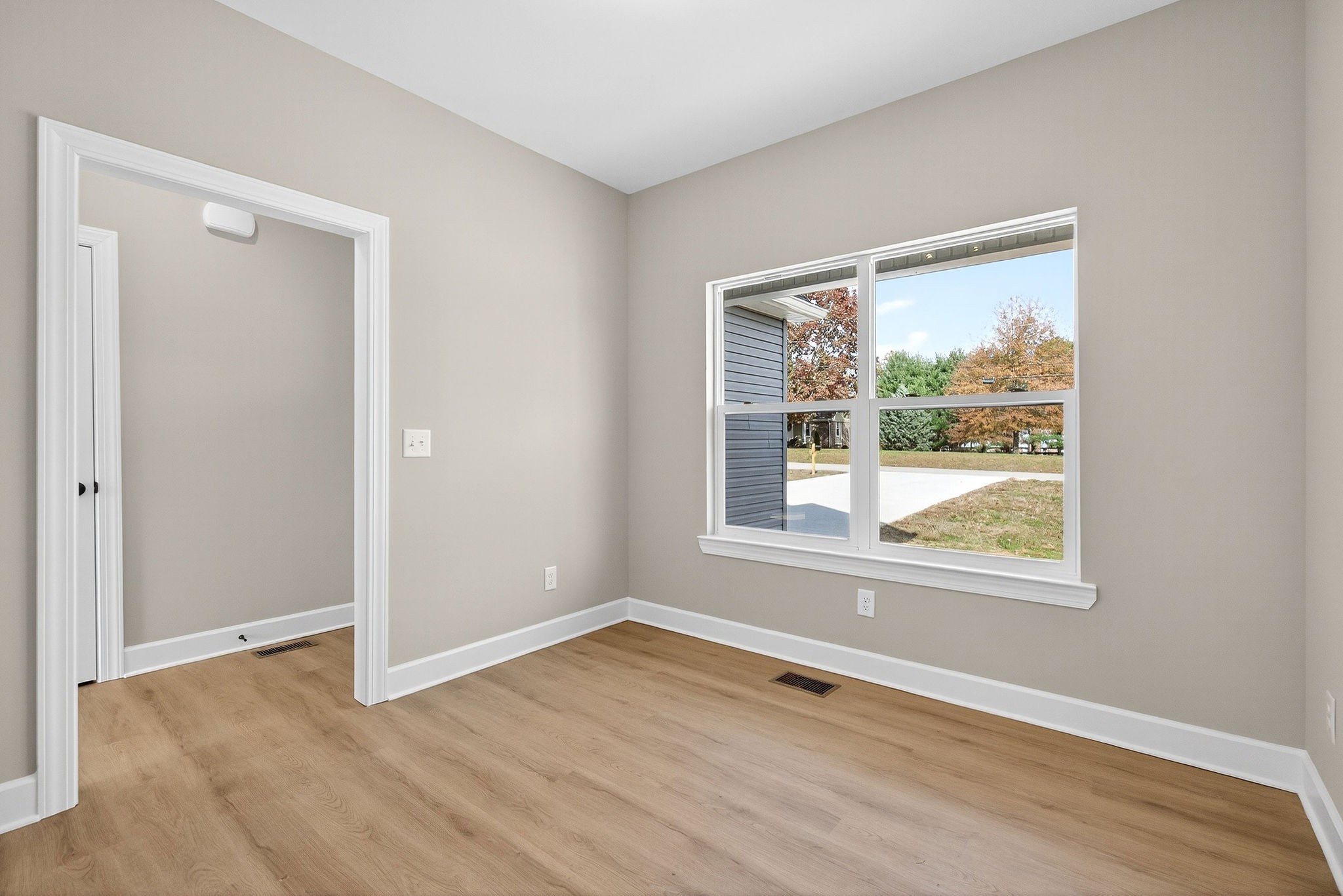 774 C Rody Road McMinnville, TN 37110 - Photo 12 of 40 an empty room with wooden floor and a window